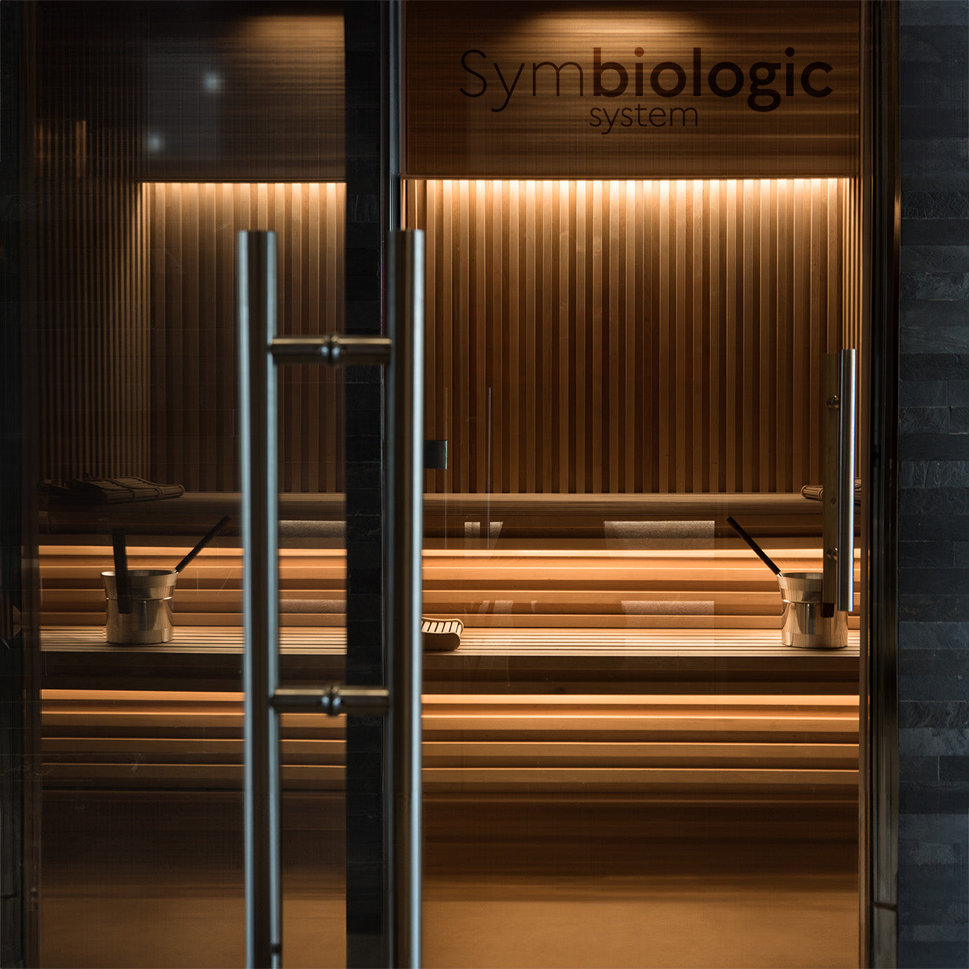 Image of a relaxing wooden sauna, showcasing the warm, inviting interior with gently glowing embers, designed to offer a serene and healthful retreat for relaxation and detoxification.