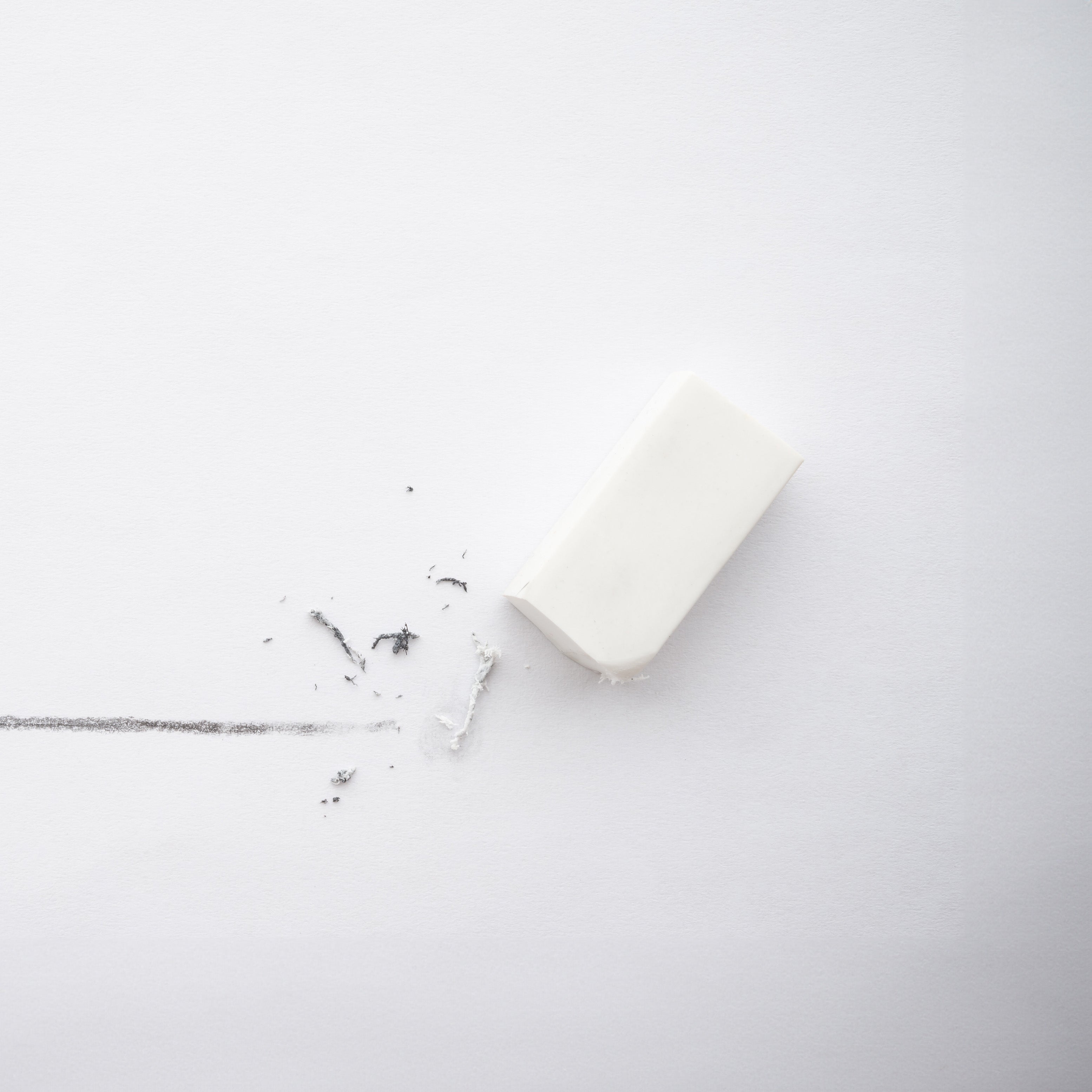 Image of an eraser gently removing a pencil mark, representing targeted action on imperfections and sebum regulation.