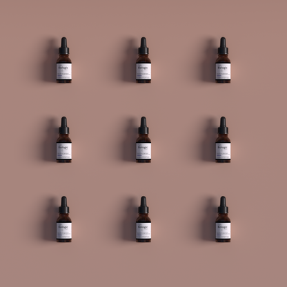 Image of nine Anti-Aging Smoothing Lift Serum bottles displayed in a 3x3 square grid from the front, against a light red backdrop, highlighting the product&